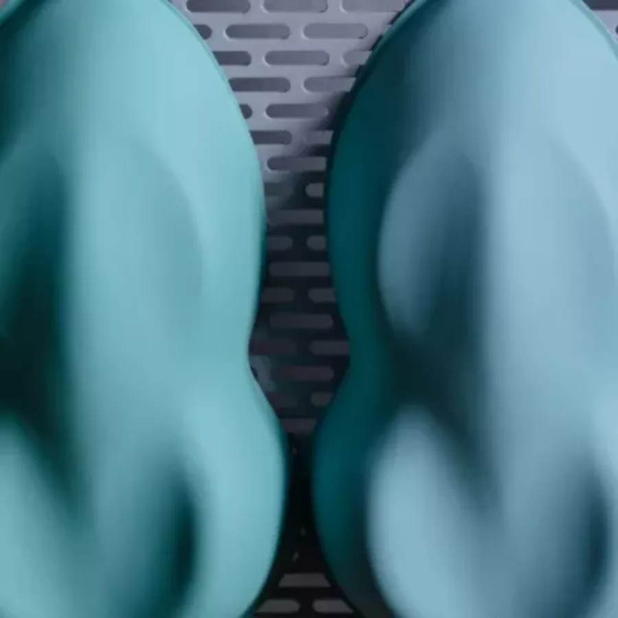 Visuel présentant des formes turquoises servant aux techniques industrielles que maitrise Creaform